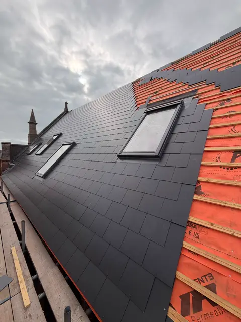 Striking half-slated roof, crisp lines: slate roof by LR Roofing near Weymouth, Dorset