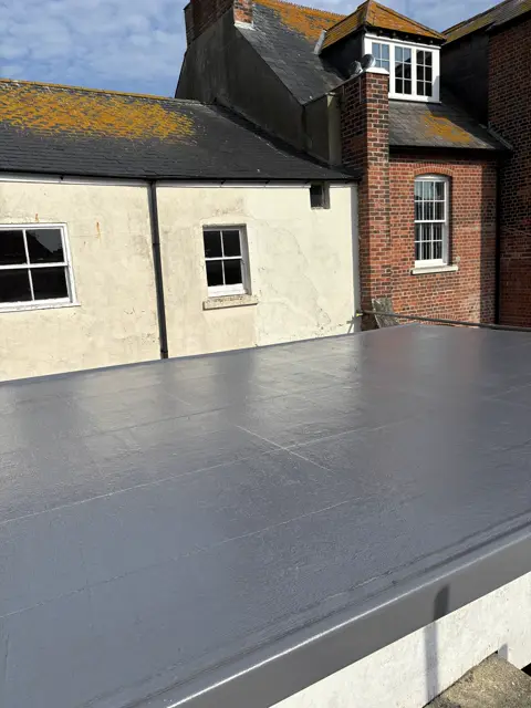Crisp dark grey GRP flat roof: grp fibreglass roof by LR Roofing near Weymouth, Dorset
