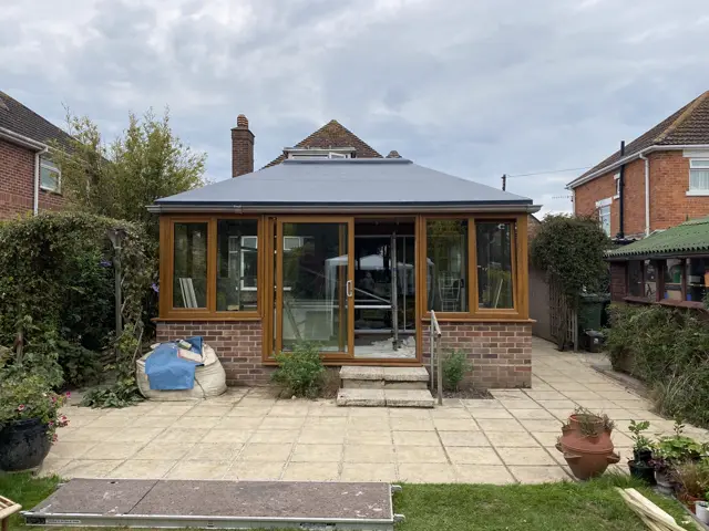 Solid conservatory roof, full elevation: tile roof by LR Roofing near Weymouth, Dorset