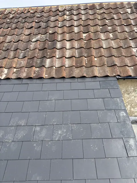 New slate below old tiles: slate roof by LR Roofing near Weymouth, Dorset