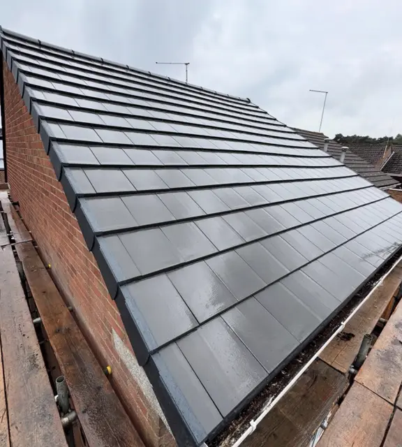 Full new grey tiled roof, excellent: tile roof by LR Roofing near Weymouth, Dorset