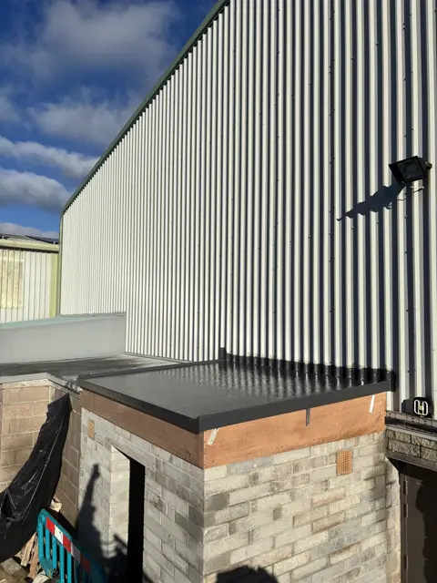 Neat dark EPDM roof, clean trims: flat roof by LR Roofing near Weymouth, Dorset