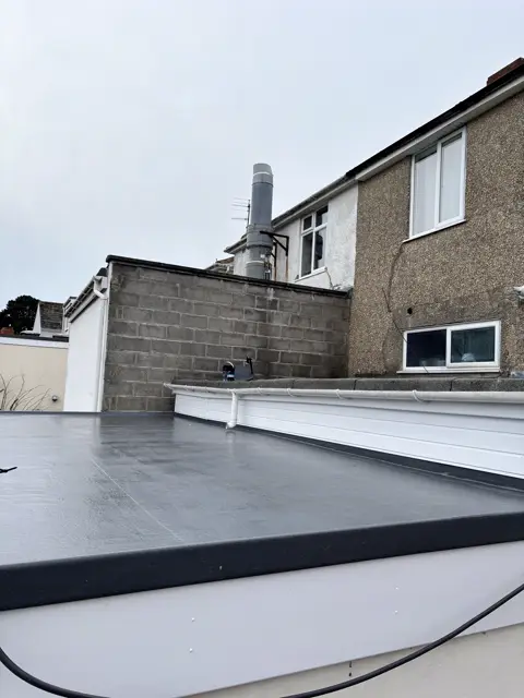 Clean EPDM roof and white fascia: flat roof by LR Roofing near Weymouth, Dorset