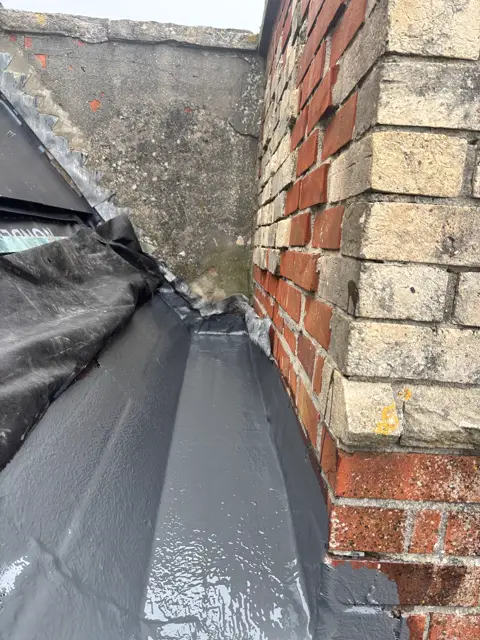 Coated parapet gutter, tight framing: leadwork and chimney by LR Roofing near Weymouth, Dorset