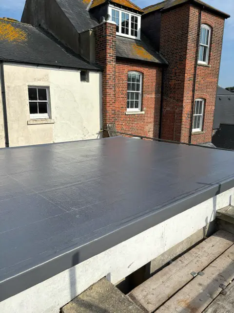 Clean grey membrane flat roof: flat roof by LR Roofing near Weymouth, Dorset